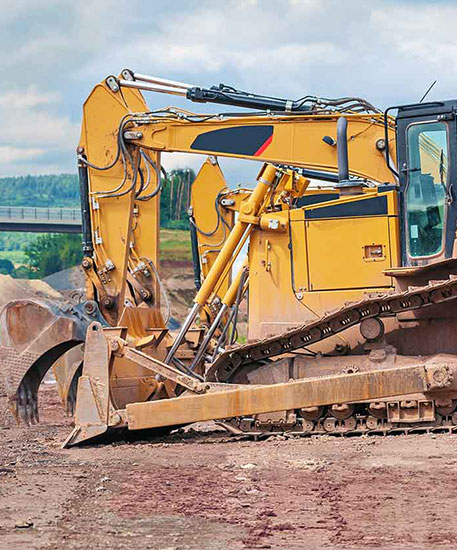 Yellow excavator on construction site