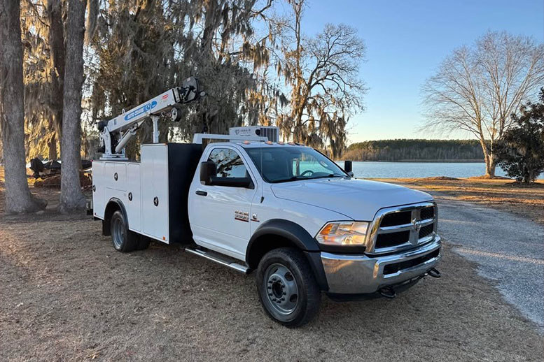 White utility truck with boom lift